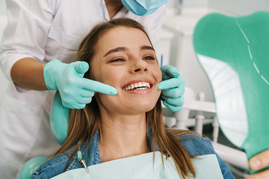 Smiling young woman in the dentist's chair